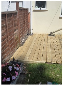 Closer view of completed timber decking and fence line